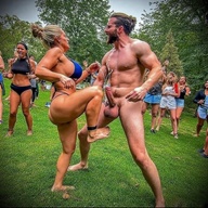 Woman beats a man, then busts his balls.